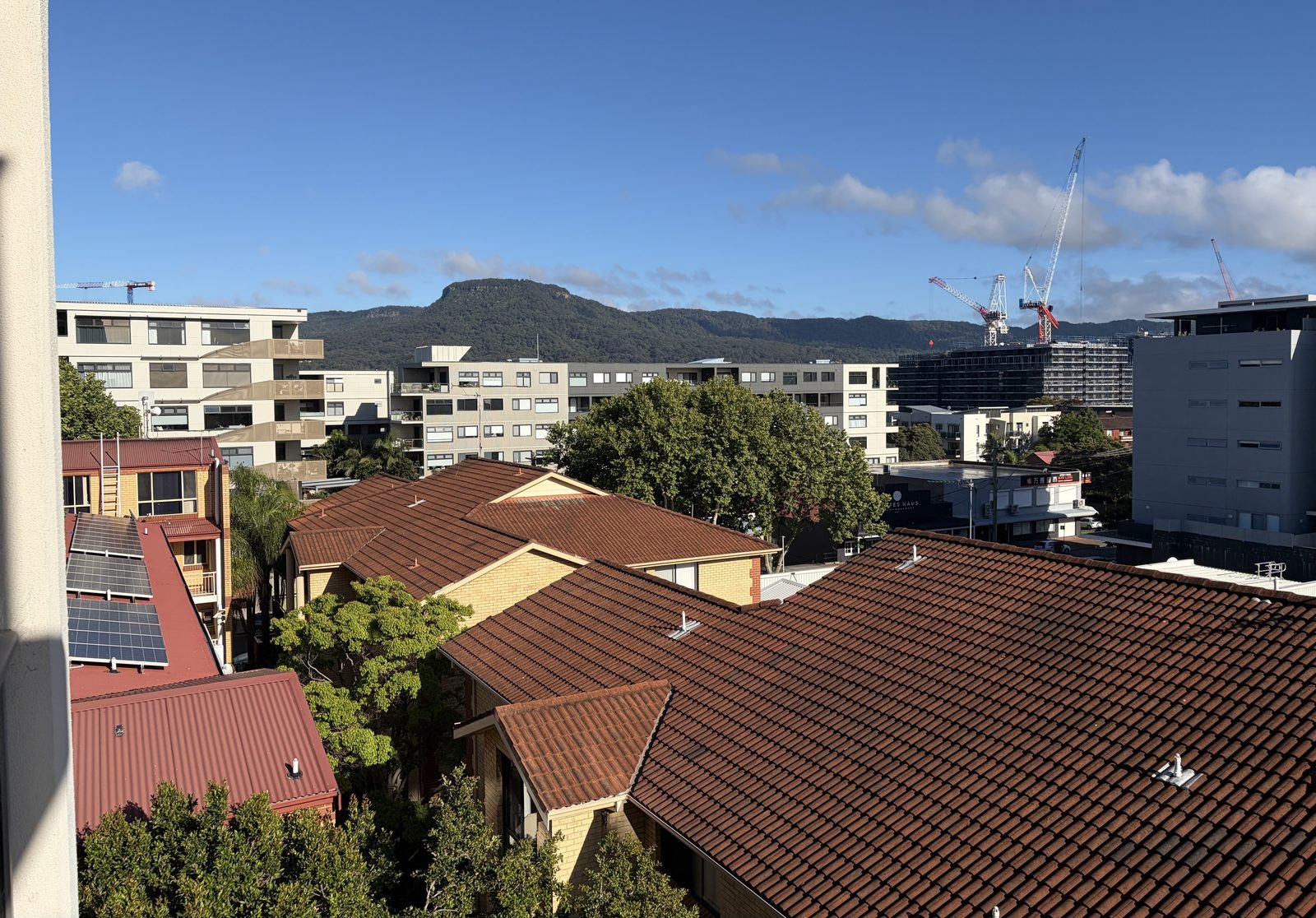 Existing view west from level 4 of 88 Smith Street with Mt Keira on the skyline above the rooftops